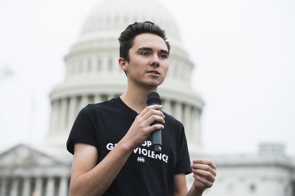 David Hogg speaking with microphone in hand. Location: Washington D.C.